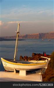 sailing in europe greece santorini island hill and rocks on the summertime beach sunset boat