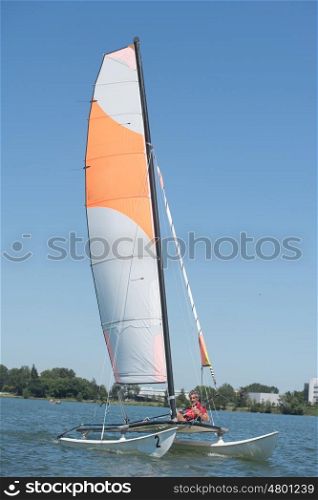 sailing on a lake - summer and sports theme