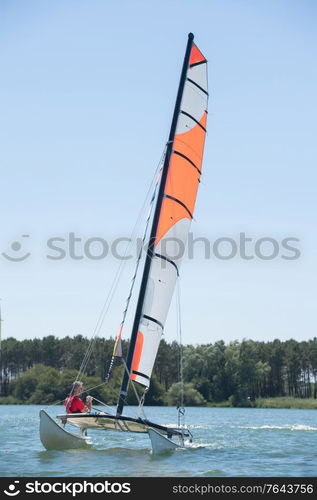 sailing on a lake - summer and sports theme