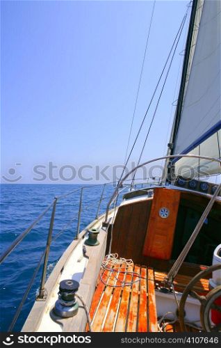 Sailing with an old sailboat over blue mediterranean summer sea