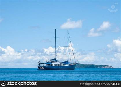 Sailing yacht cruise in the blue sea and sky