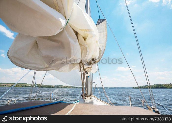 Sailing yacht on big river