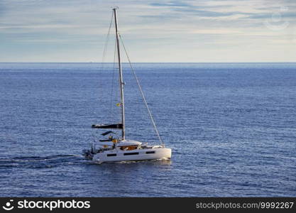 Sailingboat in the Adriatic Sea by the shore of Croatia