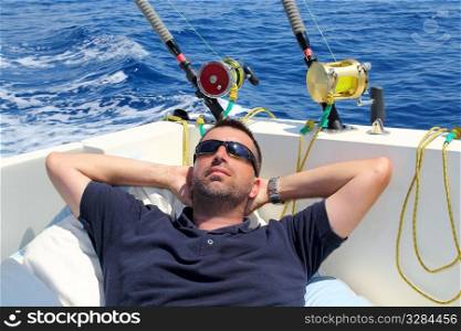 Sailor man fishing resting in boat summer vacation blue sea