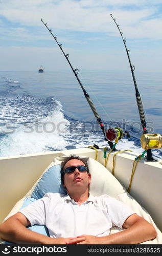 Sailor man fishing resting in boat summer vacation blue sea