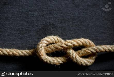 sailor's knot on stone plate