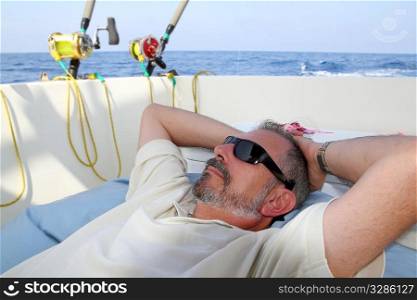 Sailor senior fisherman relax on boat fishing deep sea