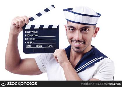 Sailor with movie clapper on white