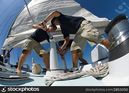 Sailors During Yacht Race Raising Sail