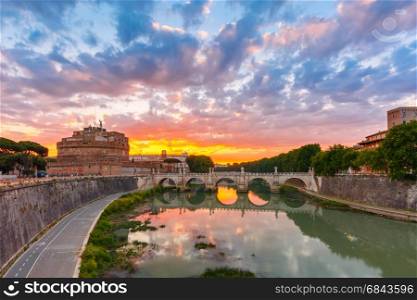 Saint Angel castle and bridge at sunrise, Rome. Saint Angel castle and bridge with mirror reflection in Tiber River during gorgeous dawn in Rome, Italy.