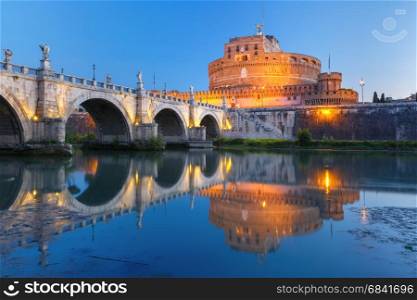 Saint Angel castle and bridge, Rome, Italy. Saint Angel castle and bridge and Saint Peter Cathedral with mirror reflection in Tiber River during morning blue hour in Rome, Italy.