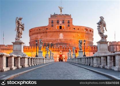 Saint Angel castle and bridge, Rome, Italy. Saint Angel castle and bridge and Saint Peter Cathedral during morning blue hour in Rome, Italy.