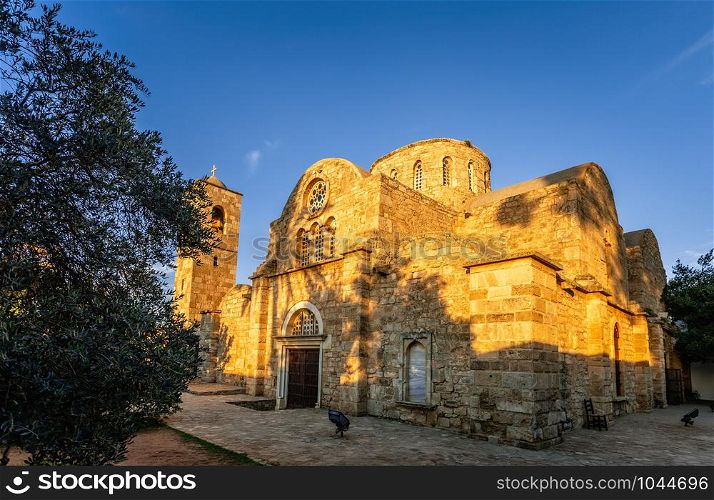 Saint apostle Barnabas monastery and the bell tower in sunset rays, near Famagusta, North Cyprus