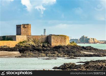 Saint Aubin Fort in a low tide with Elizabeth castle in the background, La Manche channel, bailiwick of Jersey, Channel Islands