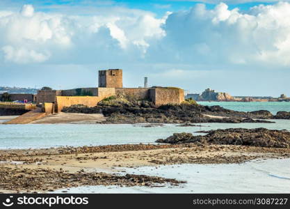 Saint Aubin Fort in a low tide with Elizabeth castle in the background, La Manche channel, bailiwick of Jersey, Channel Islands