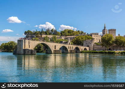 Saint Benezet bridge and Palace of the Popes in Avignon in a beautiful summer day, France