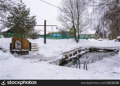 Saint Bogoroditsyn spring on a winter day in the village of Vyatskoye, Yaroslavl Region, Russia.