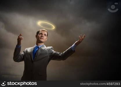 Saint businessman. Image of businessman with halo above head