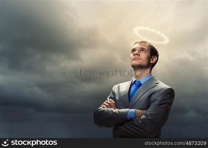 Saint businessman. Image of businessman with halo above head