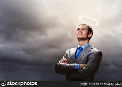Saint businessman. Image of businessman with halo above head