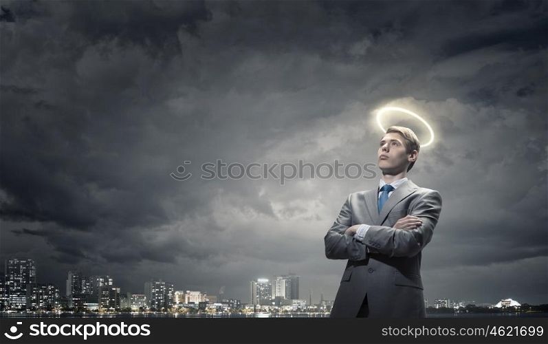 Saint businessman. Young saint businessman with halo above head
