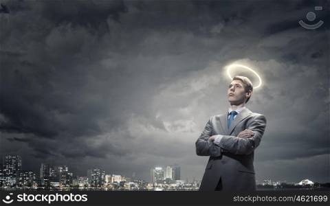 Saint businessman. Young saint businessman with halo above head