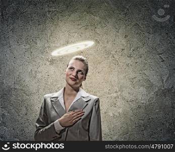 Saint businesswoman. Image of businesswoman with halo above head