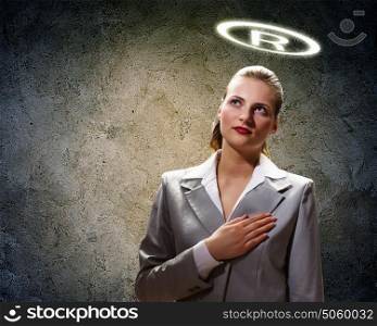 Saint businesswoman. Image of businesswoman with halo above head