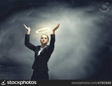 Saint businesswoman. Young crying businesswoman with halo above head