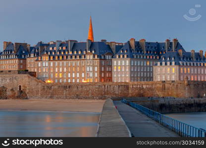 Saint Malo. View of the old town.. View of the old town with a breakwater at sunset. Saint Malo. Brittany. France.