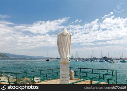 Saint Margherita Ligure. Statue on the seafront.. Sculpture of the patron saint city Saint Margherita Ligure on the central waterfront.