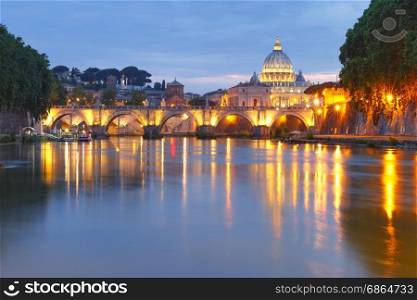 Saint Peter Cathedral at night in Rome, Italy.. Saint Angel bridge and Saint Peter Cathedral with a mirror reflection in the Tiber River during evening blue hour in Rome, Italy.