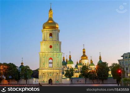 Saint Sophia&rsquo;s Cathedral with bell tower view at twilight, blooming chestnut trees and afterglow sky in background, Kyiv, Ukraine