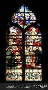 Saint Vincent de Paul raising a newborn and christening, stained glass, Saint Severin church, Paris, France