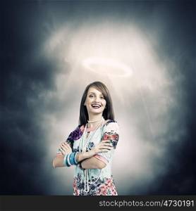 Saint woman. Young pretty woman with halo above head