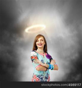 Saint woman. Young pretty woman with halo above head