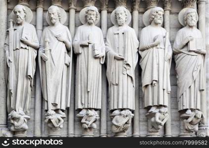 Saints on fasade of The Notre Dame de Paris. France.