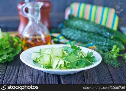 salad cucumber on white plate and on a table