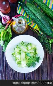 salad cucumber on white plate and on a table