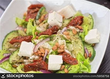 Salad feta cheese. Salad feta cheese lettuce sausage cucumbers and pine nuts