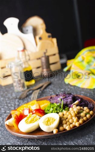 Salad - Flavor Dish Made From Tomato, Cucumber, Red cabbage, and Parsley, Chickpeas Served With Hard Boiled Egg and Tahini Sauce