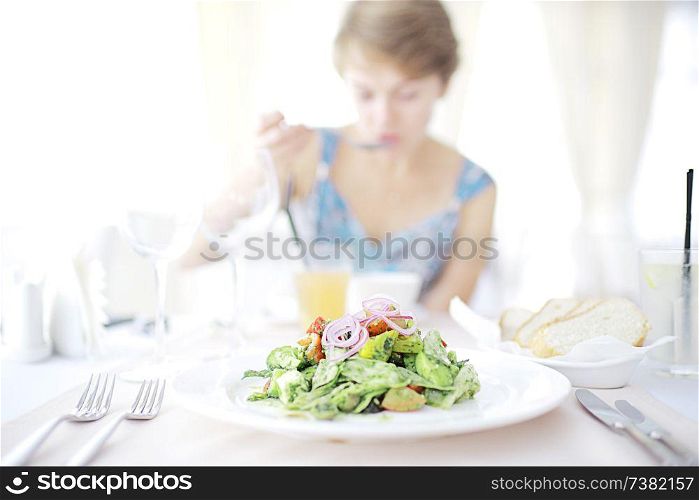 Salad in a cafe diet girl