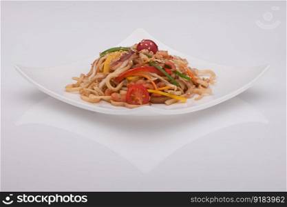salad in a white plate on a white background. salad in a white plate