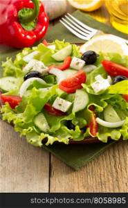 salad in plate on wooden background