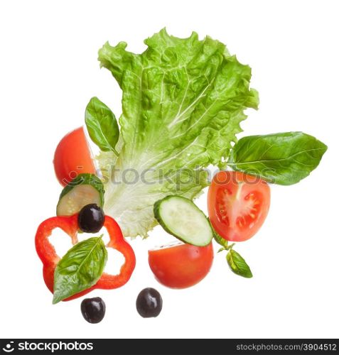 salad isolated in white - red tomatoes, pepper, basil, cucumber and olives, top view