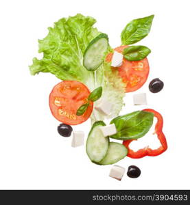 salad isolated in white - red tomatoes, pepper, cheese, basil, cucumber and olives, top view