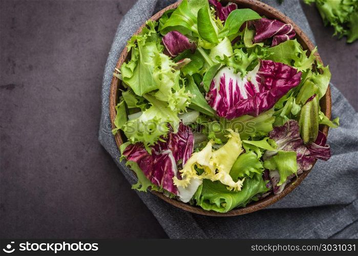 Salad mix with rucola. Fresh vegetable salad, healthy food, sala. Salad mix with rucola. Fresh vegetable salad, healthy food, salad leaves. Dietary food concept. Vegetable background.