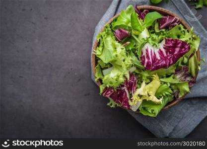 Salad mix with rucola. Fresh vegetable salad, healthy food, salad leaves. Dietary food concept. Vegetable background.
