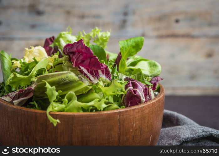 Salad mix with rucola. Fresh vegetable salad, healthy food, salad leaves. Dietary food concept. Vegetable background.