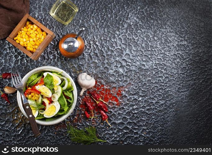 Salad of eggs and corn kernels with vegetables. Close-up